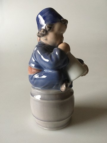 Royal Copenhagen Figurine of a Boy on barrel with a horn No. 3689