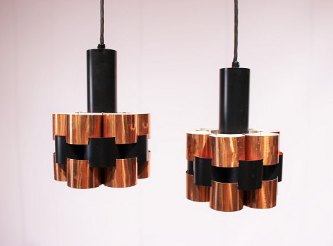 A pair of ceiling pendants in of cobber and black lacquered metal by Werner 
Schou from the 1960s.
