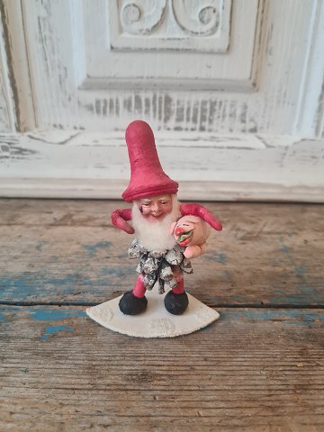 Old pine cone elf with pig