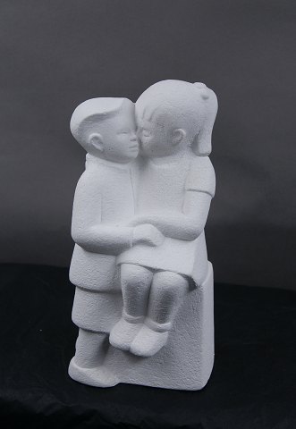 Stone Art white figurine from Marbell, The Netherlands. Couple of siblings on a bench.