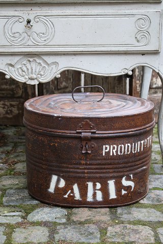 Old oval metal box with old original paint, fine patina and writing on the side 
"Paris"...