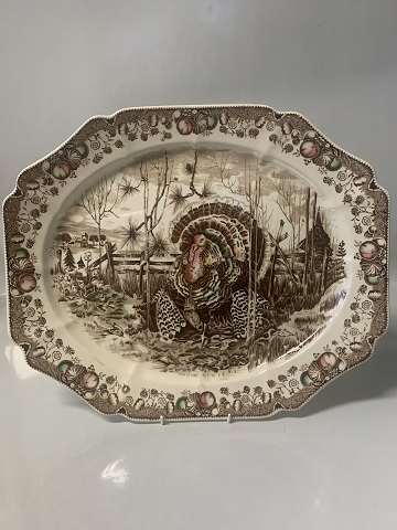Serving platter English.Motif: Turkey and forest.Measures 36.5 x 43.8 cm.