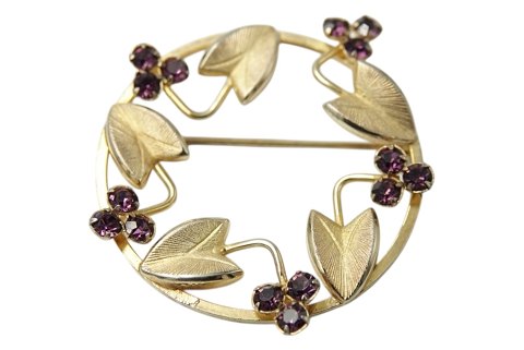 Bond Boyd sterling silver
Gilded brooch with purple stones