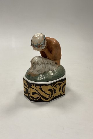 Royal Copenhagen Gerhard Henning Overglaze Figurine “ Weeping Faun on stand “ 
No. 1188