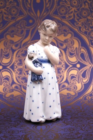 Royal Copenhagen porcelain figurine of a little girl with a doll on her arm...
