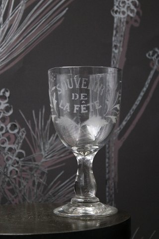 Old French souvenir wine glass with engraved writing and decorations. "Souvenir 
de la feté"