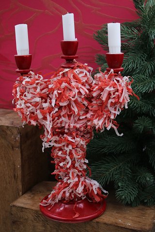 Old Swedish Christmas candlestick in red painted wood 
decorated with tissue paper...