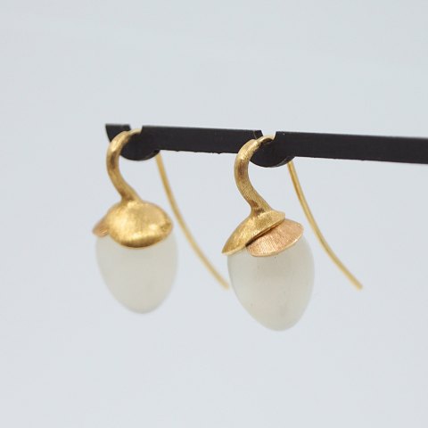 Ole Lynggaard; Pair of Lotus earrings in 18k gold with moonstone