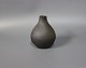 Dark Brown ceramic vase stamped Dagma.5000m2 showroom.
