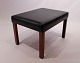 Stool with legs of rosewood and upholstered with black leather of danish design 
from the 1960s.
5000m2 showroom.
