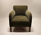 Easy chair upholstered with green fabric of danish design from the 1960s.5000m2 showroom.