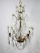 Chandelier of brass and polished prisms from France around the 1920s.5000m2 showroom.