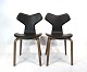 A pair of Grand Prix chairs, model 4130, of Walnut veneer and black leather, by Arne Jacobsen and Fritz Hansen.5000m2 showroom.