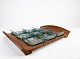 Serving tray in teak with six matching glass bowls by Jens Harald Quistgaard 
from around the 1960s.
5000m2 showroom.
