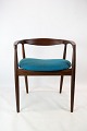 Armstol i palisander, model Troja, polstret med blåt stof designet af Kai Kristiansen fra 1960erne.5000m2 udstilling.
