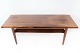 Coffee table in rosewood with shelf, of Danish design from the 1960s.5000m2 showroom.
