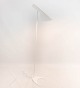 White floor lamp designed by Arne Jacobsen and manufactured by Louis Poulsen. 5000m2 showroom.