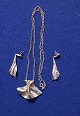 Piece of jewelery in a necklace and a pair of pendants with earrings in silver 925 by Danish silversmith Bent Larsen.