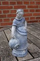 Hjorth Danish stoneware figurine in blue glaze. Girl with jar