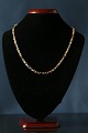 Antik Huset 
presents: 
Anker Bow 
gold chain in 
14 carat gold, 
beautiful 
pattern and 
with box lock.