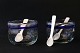 Small glass bowls with blue ribbon, and mother-of-pearl spoons. Ideal for salt and pepper.