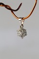 Star-shaped pendant in 14 carat white gold, with Diamonds. Stamped 585