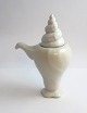 Royal Copenhagen. White Conch. design; Arje Griegst. Creamer. Height 14.5 cm. Model 395. Slight color difference on the lid. (1 quality).