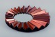 Olivier de Schrijver (1958), French designer. Futuristic "Simba Rouge" unique wall mirror made of copper-colored metallic acrylic glass. Faceted mirror.