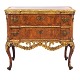 Walnut veneered and partly gilt commode made by the manufacture Köster, Altona, 
Northgermany, circa 1770. H: 78cm. Top: 87x43cm