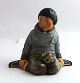 Royal Copenhagen. Porcelain figure. Greenlander boy. Model 12419. Height 9.5 cm. 
(1 quality).