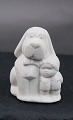 Stone Art slightly sandy colored figurine from 
Marbell, Belgium. 2 Friends or Dog look after 
baby.