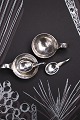A pair of small Georg Jensen salt bowls with spoons in sterling silver with 
handles...
