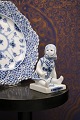 Royal Copenhagen, small Blue Fluted sitting girl. 
1/4793...