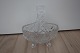 An old bowl made of crystal glass 
With 4 feet and a handle
L: 13cm
H: 15cm
A beautiful decoration in the glass
In a very good condition