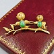 Brooch with birds in 14k gold set with jade and ruby