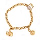 14kt gold Ole Lynggaard Copenhagen bracelet with two charms and white gold 
clasp. L: 19,5cm