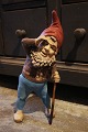 Antique terracotta gnome with old paint and a fine patina...