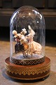 Old French mechanical music box with movement by the brand Reuge, with a rococo couple dancing around...