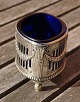 Oval silver plated salt cellar on 4 legs with deep blue glass insert by WMF