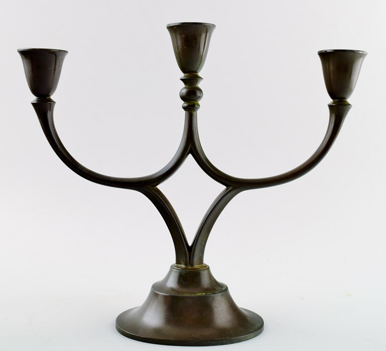 Just Andersen, candlestick in patinated metal.