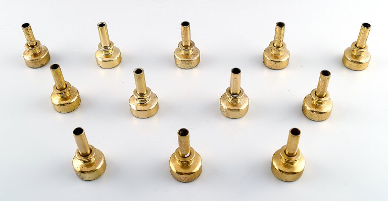 Hans Agne Jakobsson, Markaryd, Sweden, 12 candlesticks in brass.