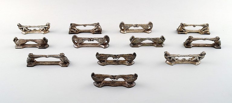 Tolv franske design knivblokke i form af aber, pelikaner, haner, elefanter m. fl.