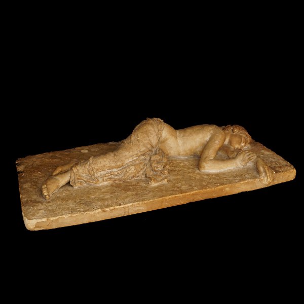 Laurits Tuxen, 1853-1927: Sculpture, woman. Signed "LT ROM 1885). L: 95cm. W: 
50cm. H: 19cm