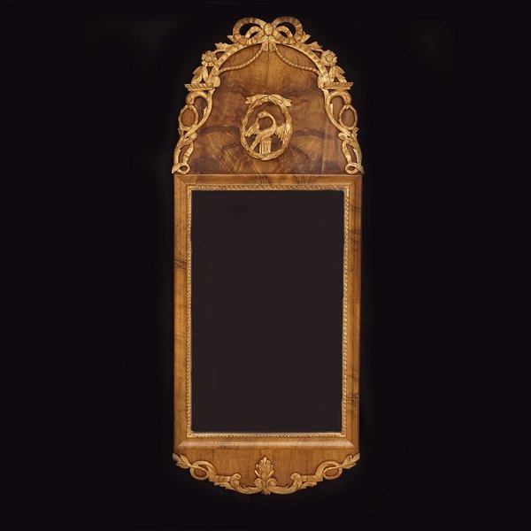 A Louis XVI gilt walnut veneered mirror. Schleswig.Holstein, Northgermany, circa 1780. 104x41cm