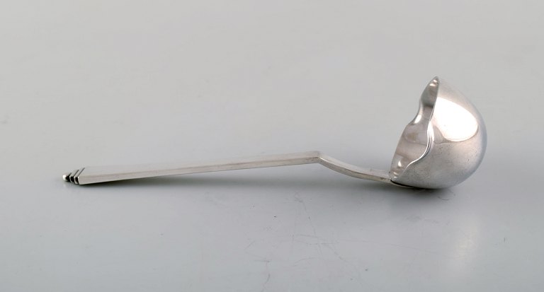 Georg Jensen "Pyramid" sauce spoon in all silver.