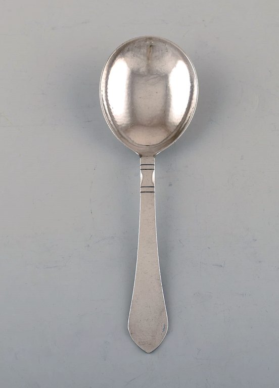 Georg Jensen Continental serving spoon in hammered sterling silver.