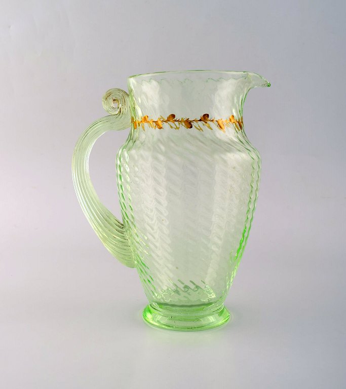 Emile Gallé (1846-1904). Early and rare jug in mouth-blown light green art glass with hand-painted gold decorations in the form of leaves. Museum quality, 1870s / 80