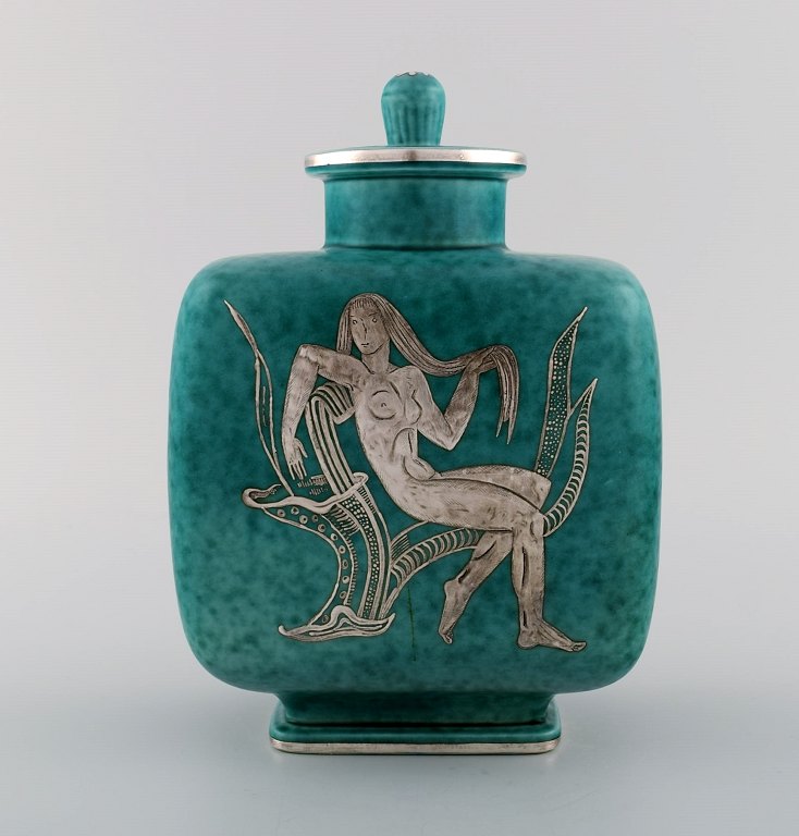 Wilhelm Kåge for Gustavsberg. Argenta art deco ceramic lidded jar decorated with nude woman in silver inlay. Sweden 1940