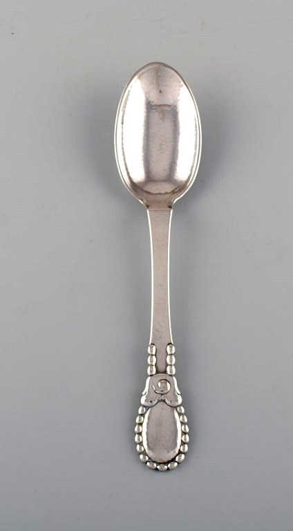 Evald Nielsen number 13 large tablespoon in hammered silver (830). Dated 1924.