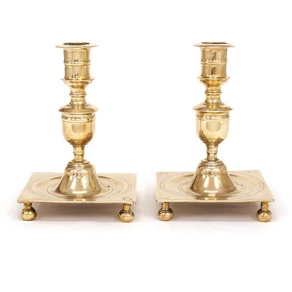 A pair of mid 18th century brass candlesticks. Denmark circa 1740. H: 22cm. Base: 15x15cm